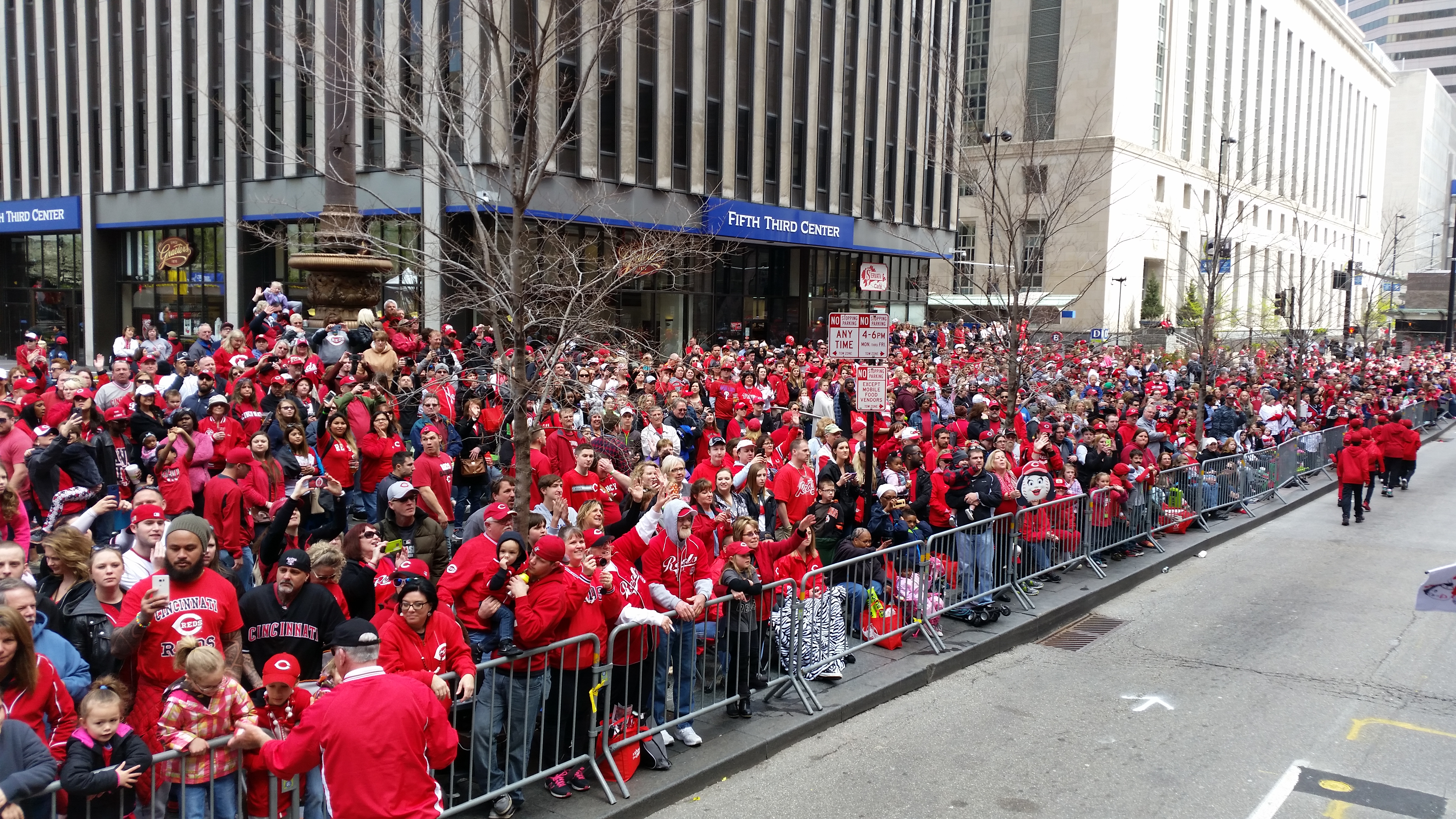Fans line the streets to watch the Cincinnati Reds Opening Day Parade
